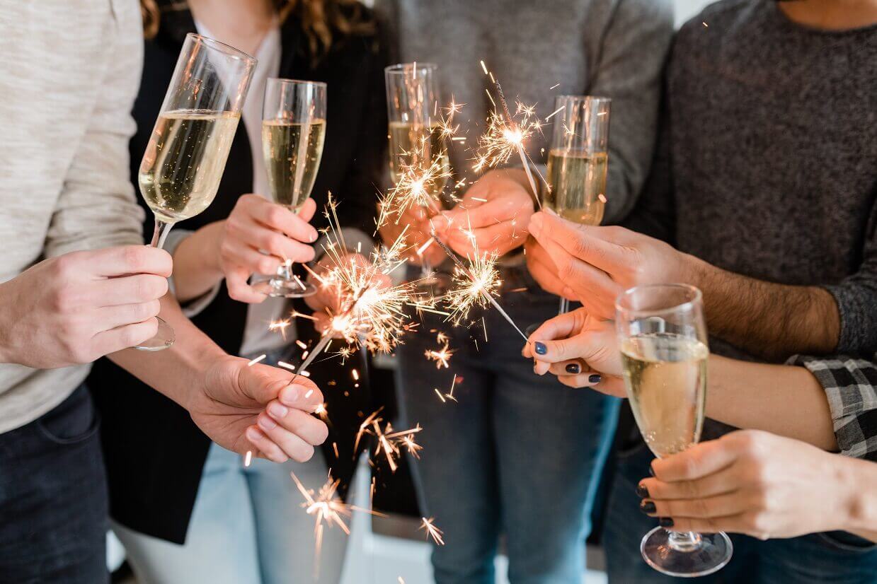 group of people toasting together for new years