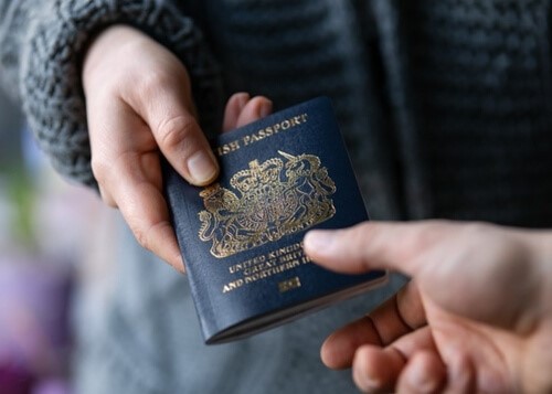 an employee handing over their passport for a right to work check