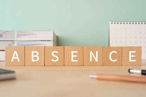 leave of absence sign on a desk