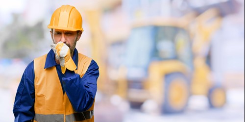 A worker having asthma attacks  after breathing in substances at work.