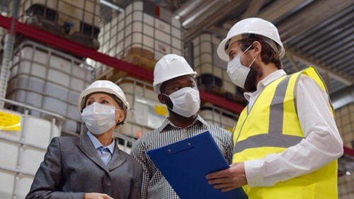 three people completing a health and safety audit.