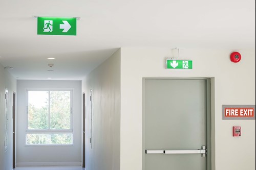 a fire door wiht a open devices remains closed, with a shut sign, thats has regular checks by the responsible person