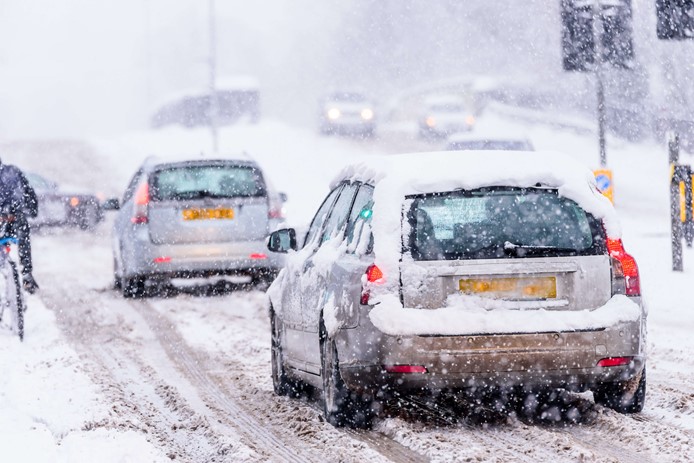 cars stuck in snow while trying to get to work