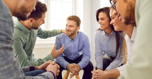 Employees engaged in group therapy as part of employee assistance programmes