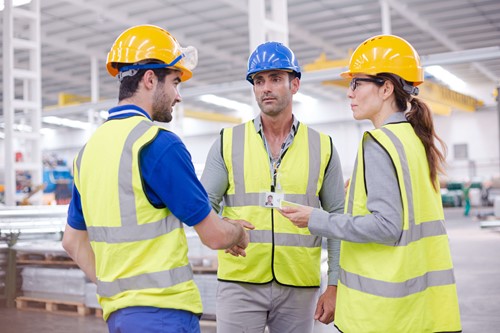 Health and safety training with two employees, to help protect their own health.