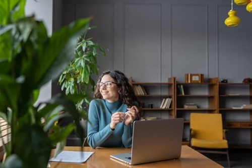 an employee using employee onboarding software to better understand their role and job description