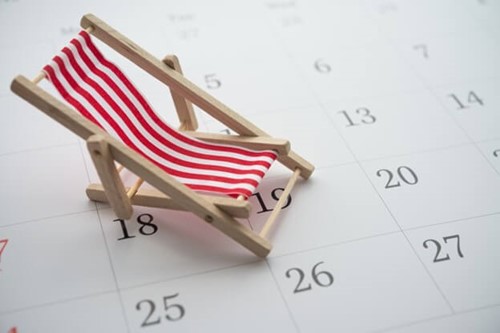 a deck chair on a calendar, after an employee has taken their holiday entitlement which is in the employee's contract.