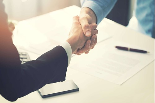 A close-up of people shaking hands