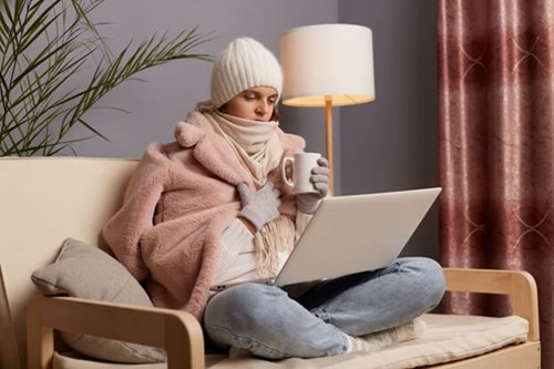 An employee working from home due to conditions being too hazardous to drive to the office.