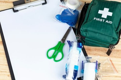 first aid at work kit, with a sheet detailing who has received first aid training as per health and safety regulations.