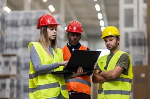 Staff carrying out a risk assessment with a designated competent person.