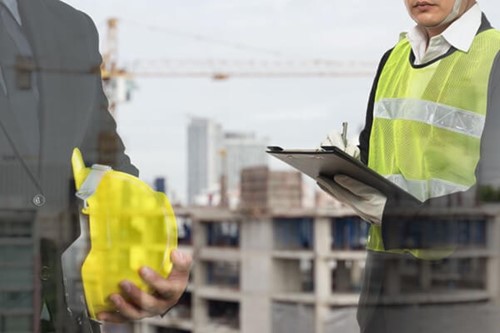 A HSE inspector conducting an assessment of a business premises