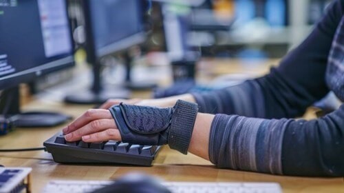 Picture of a keyboard with the words duty of care written on one of the keys as a reference to employers Duty of Care.