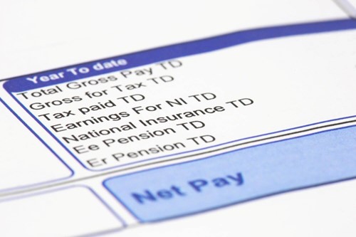 Close up of a UK Pay slip showing taxable deductions form employee gross pay.