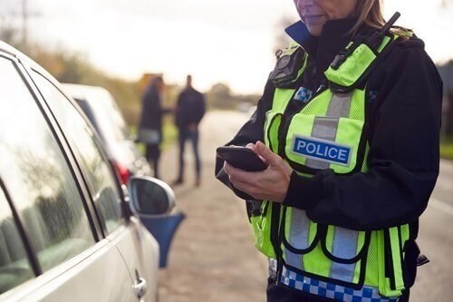 female police officer collecting evidence