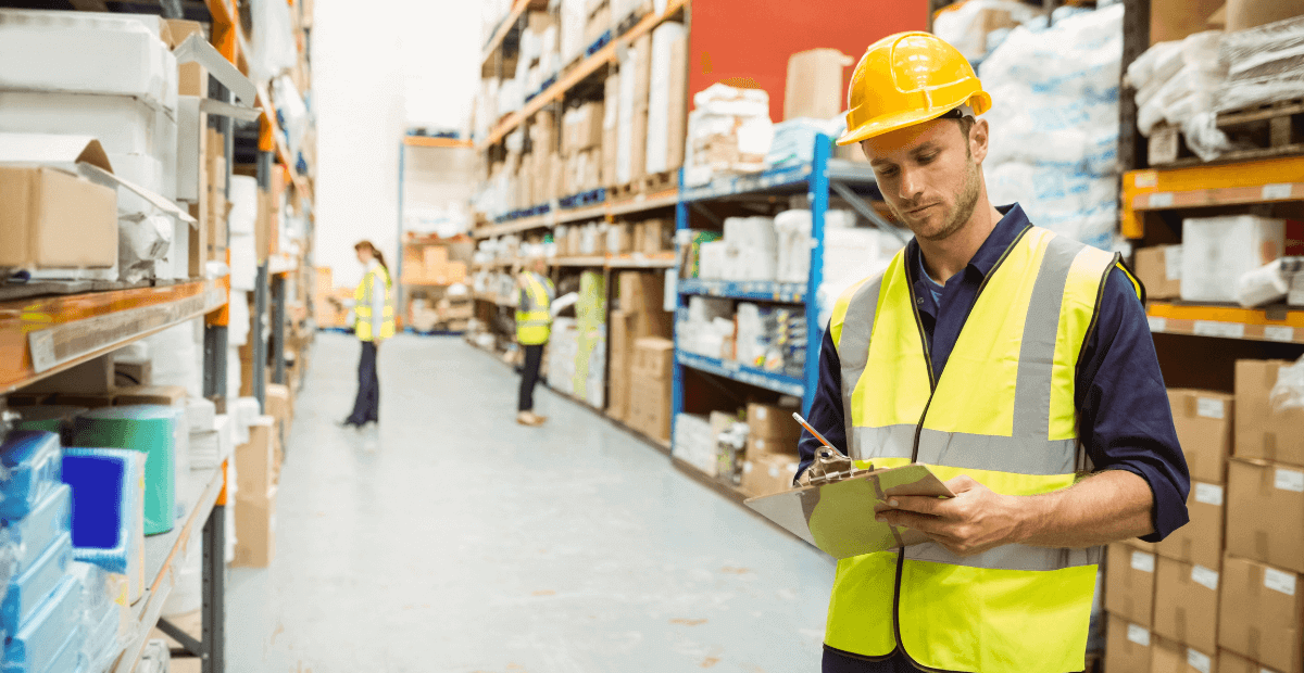 health and safety inspector running inspection of warehouse