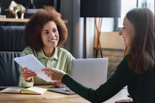 an employee recieving a probation review recieving further information on probation periods and general economic activity.