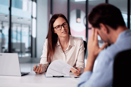 manager holding disciplinary meeting with employee