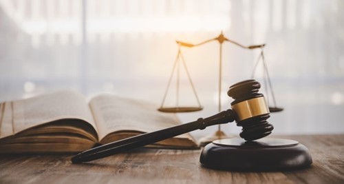 Image showcasing a judges gavel during an employment tribunal case claim automatic unfair dismissal for SOSR.